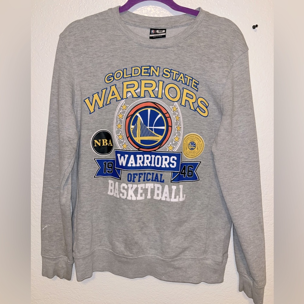 It does have a little paint stain that you can see on the left side sleeve.